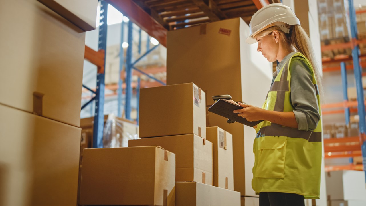 Warehouse employee using TrulinX’s inventory management feature to manage excess inventory.